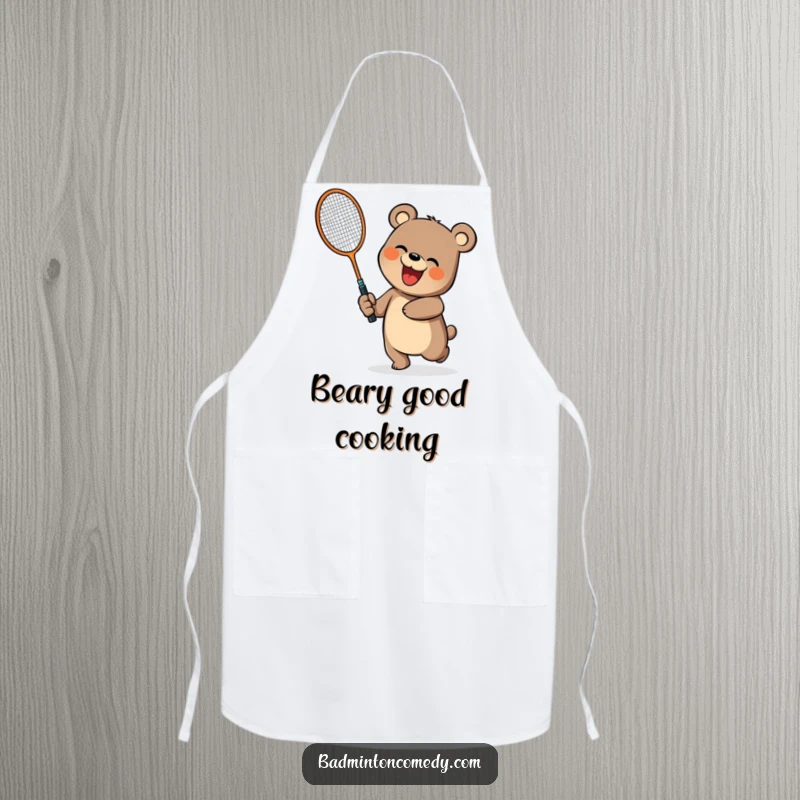 Funny bear character swinging a badminton racket on a kitchen apron, perfect for a funny gift.