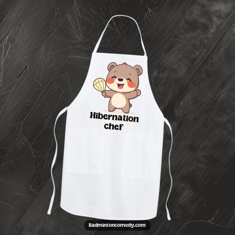 Funny Bear Badminton Apron: A smiling bear cub enthusiastically serves a shuttlecock with a badminton racket while cooking.