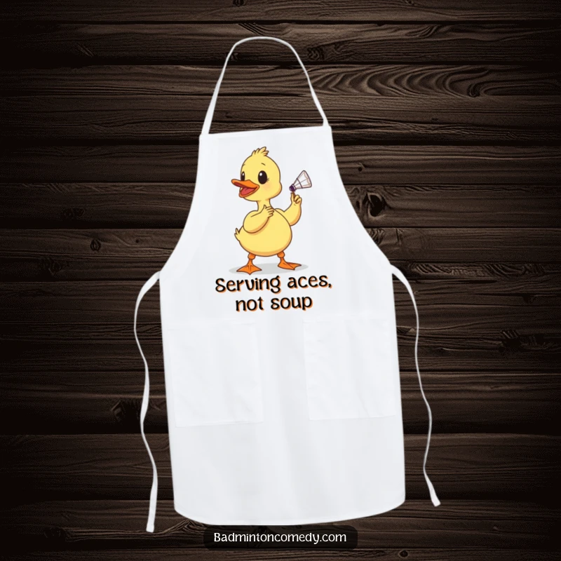 Funny duckling apron, a determined baby bird comically preparing to hit a shuttlecock with its beak, perfect for a humorous kitchen.