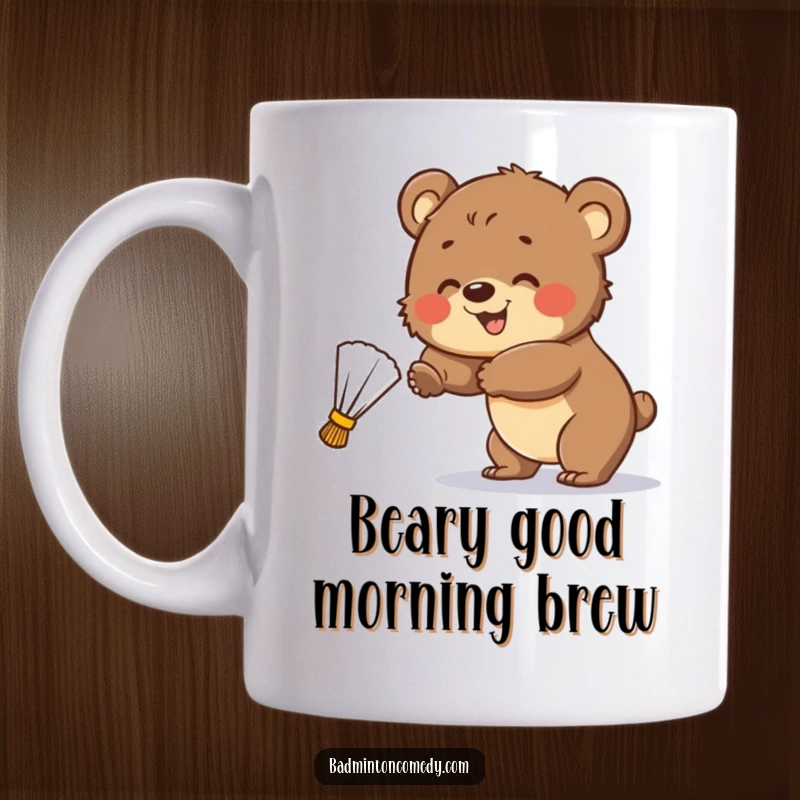 Funny Mug: A smiling bear cub playfully attempts to hit a stray badminton shuttlecock, showing effort and good humor.