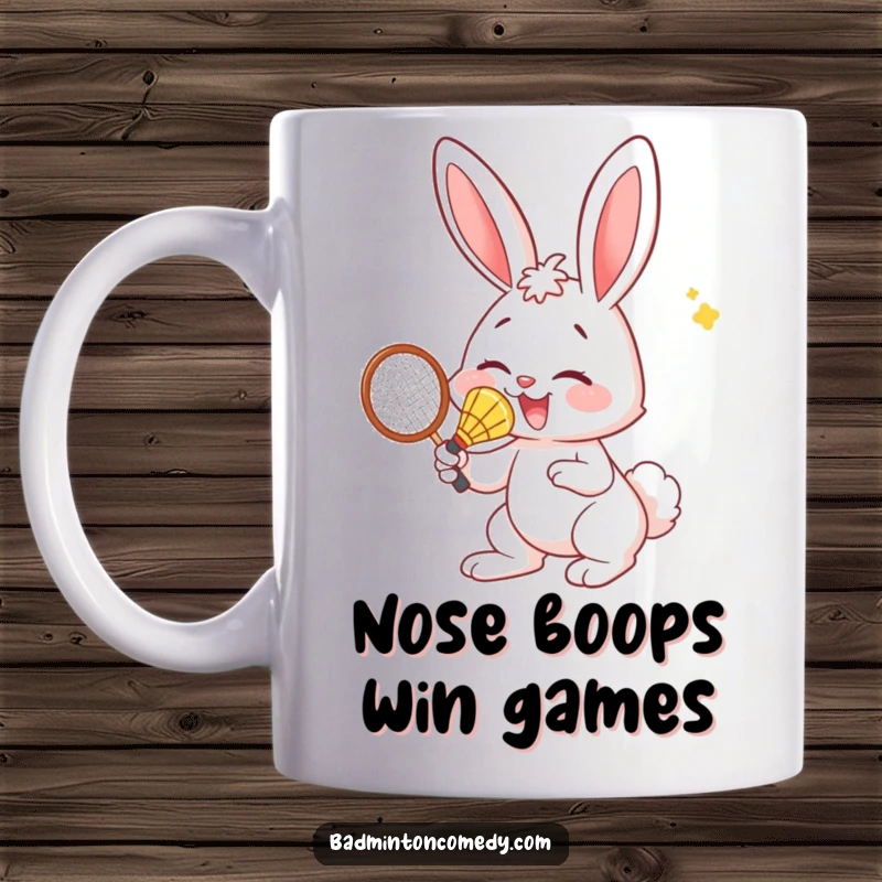 Funny Bunny Mug: A cute bunny enthusiastically hits a badminton shuttlecock with its nose in a humorous moment.
