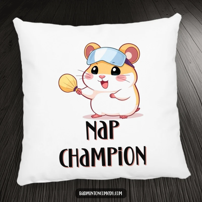 Funny hamster wearing a visor, serving a shuttlecock with a tiny racket, on a soft decorative pillow.