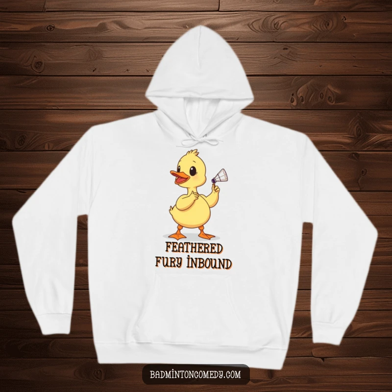 Funny duckling hoodie, a determined baby bird about to hit a shuttlecock with its beak, emphasizing its funny and sporty spirit.