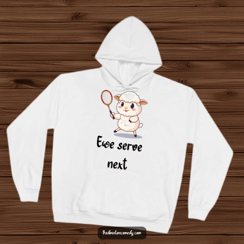 Funny determined sheep playing badminton with a shuttlecock, captured on this warm and cozy hoodie.