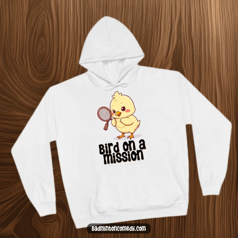 Funny chick in a tiny racket, pecking a shuttlecock with hilarious intensity on this cozy, warm hoodie.