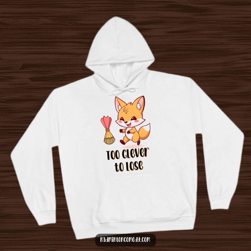 Funny, grinning fox chasing a shuttlecock on a cozy hoodie, perfect for a funny gift.