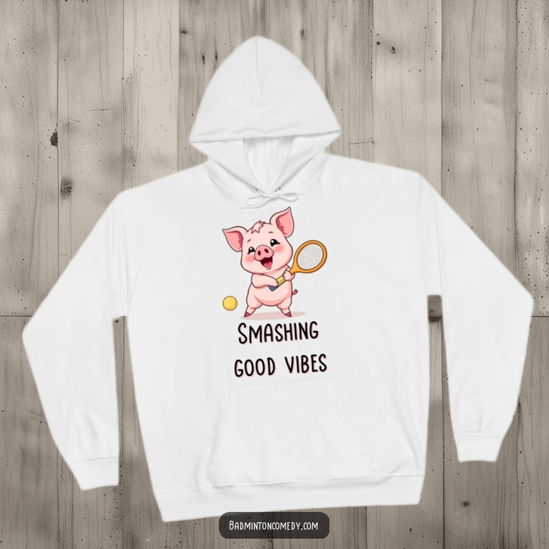 Funny Piglet Joy Hoodie: A happy piglet enthusiastically returns a shuttlecock shot with a racket, radiating pure, playful energy.