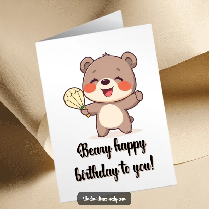 Funny Free Printable Birthday Card: A little bear happily serving a shuttlecock with a huge smile.
