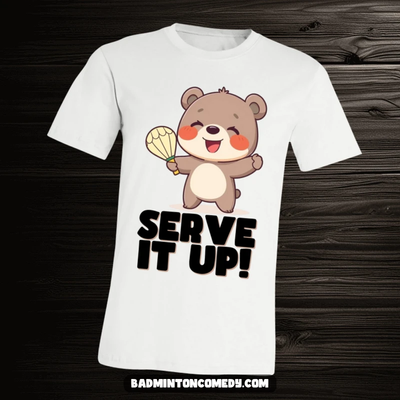 Funny Bear Badminton T-Shirt: A cute, smiling bear cub enthusiastically serves a shuttlecock with a badminton racket.
