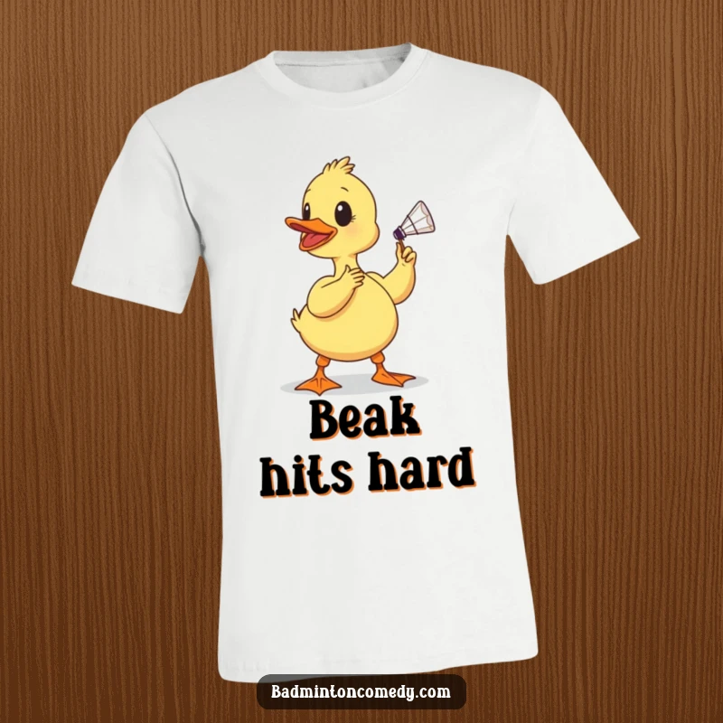 Funny duckling t-shirt, a determined baby bird comically poised to smash a shuttlecock with its beak, showcasing effort and humor.