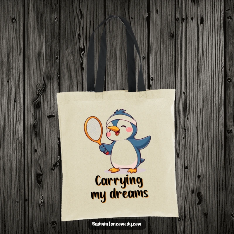 Funny penguin wearing a headband, mid-swing with a tennis racket, showcasing pure joy for functional and humorous tote bag.