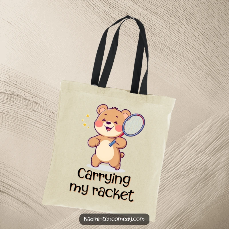 Funny Bear Badminton Tote Bag featuring a grinning bear character swinging a badminton racket, designed for stylish, humorous carrying.