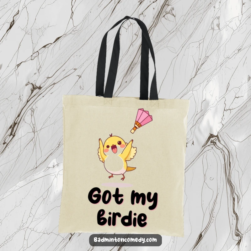 Funny tote bag with a small bird character hitting a shuttlecock upwards, ideal for carrying badminton gear or daily items.
