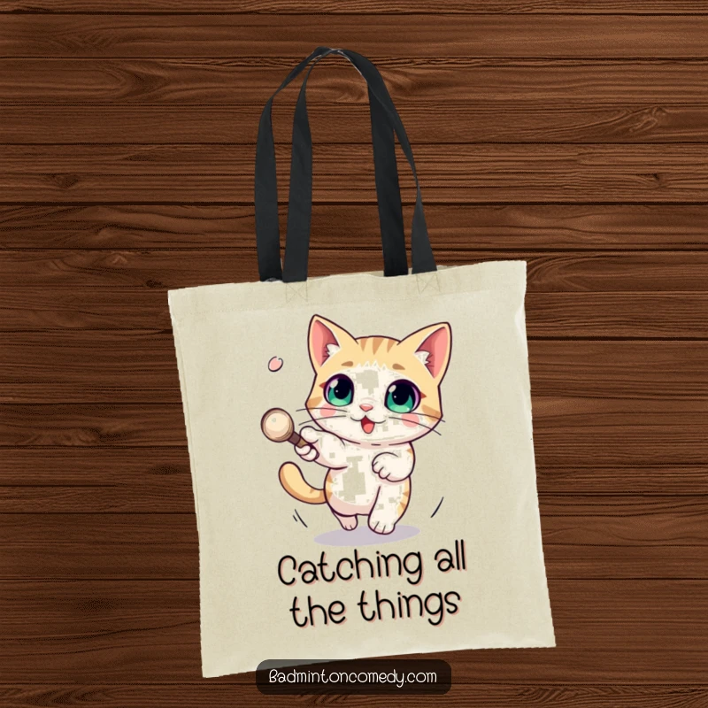 Funny tote bag featuring a wide-eyed cat character skillfully evading a fast shuttlecock, ready to carry your items with style.
