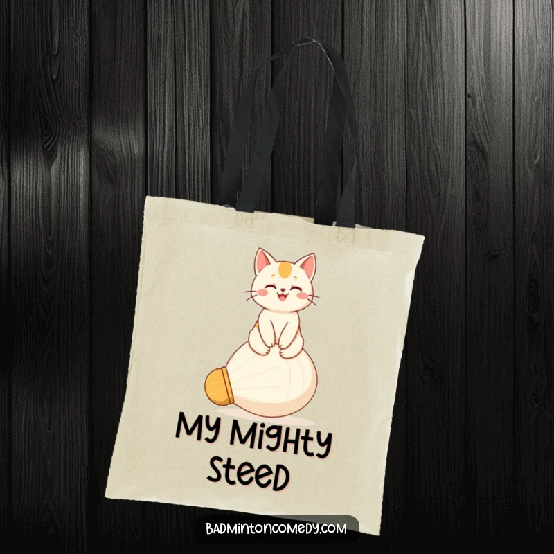 Funny tote bag with a proud, happy cat character seated regally on a giant shuttlecock, ready to carry your essentials.