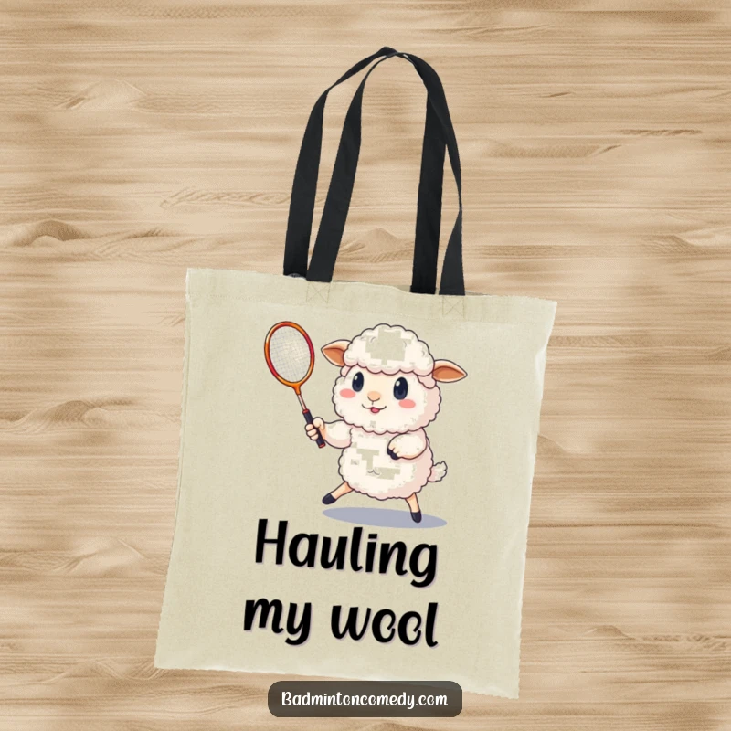 Funny fluffy sheep playing badminton with a determined expression on this practical and humorous tote bag.